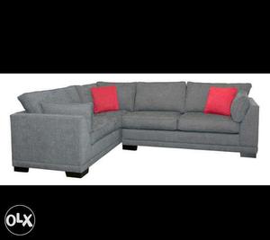 Grey Fabric Sectional Sofa And Throw Pillows