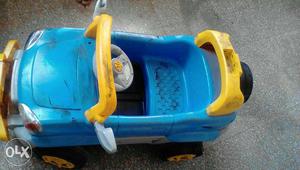 Toddler's Yellow And Blue Plastic Ride On Car