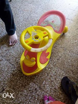 Toddler's Yellow And Red Wiggle Car