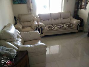 White Leather Couch, Armchair, And Loveseat