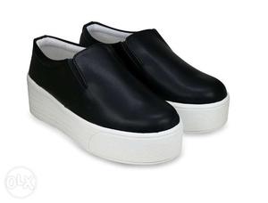Brand New High Soled Black and White Sneakers.