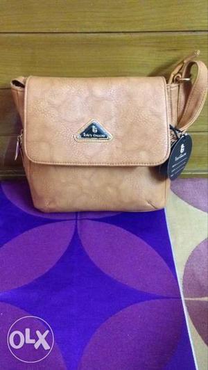 Brown cross body bag which is Brand New