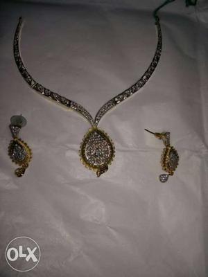 Diamond Embellished Silver And Gold Necklace And Earrings