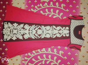 Red kurti with white work on it. not damaged or