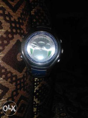 Round Silver And Blue Chronograph Watch With Leather Band