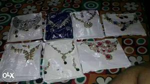 Seven Pairs Of Necklace And Earrings
