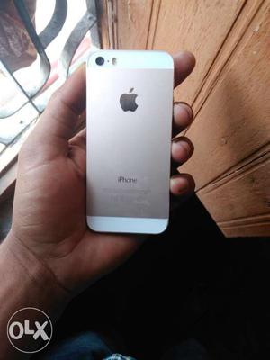 A gold color i phone 5s for sale. With charger and earphone.