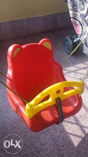 Baby swing made of plastic, ideal for babies and