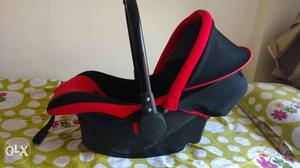 Baby's Black And Red Seat Carrier