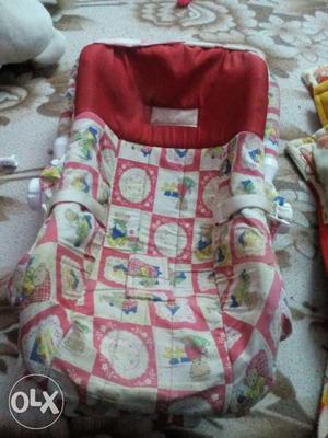 Baby's Red And White Carrier Car Seat Deck