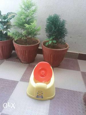 Baby's Yellow And Orange Potty Trainer