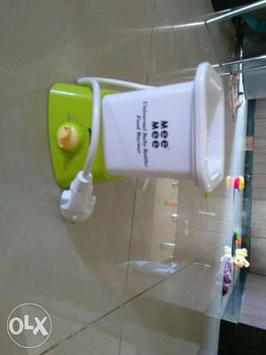 Brand new! baby bottle and food warmer mee mee brand with a