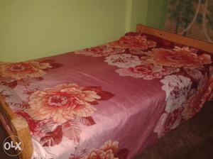 1 wooden single bed 4 by 6 inch,1 wooden table,2