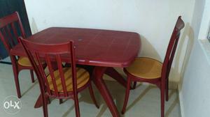 1yr used maroon dining table set including four
