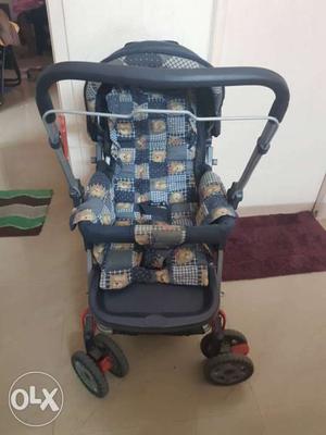 Baby's Blue And Brown Pram Stroller