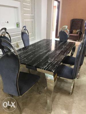 Dining table in stainless steel finish