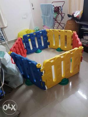 Toddler's Yellow, Red, And Blue Plastic Play Yard