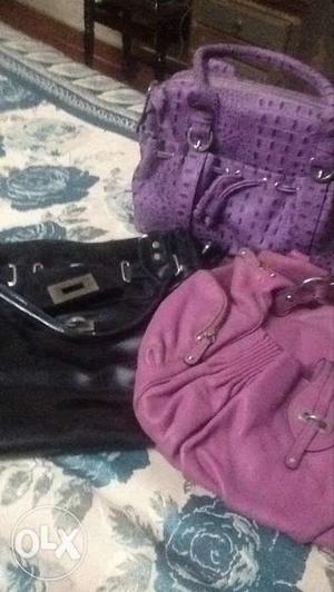 3 ladies purses black and pink used for some time