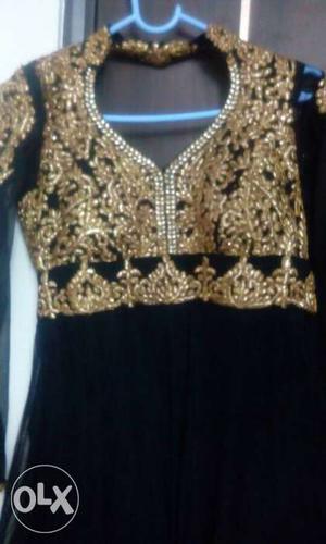 Black anarkali with gold embroidery.
