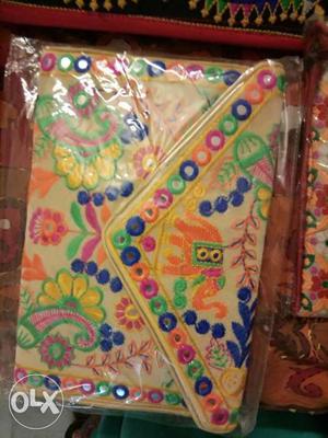 Designer multi colour embroidered bag prize- 400