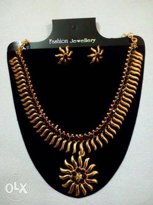 Gold Fashion Jewellery Necklace With Sun Pendant And Pair Of