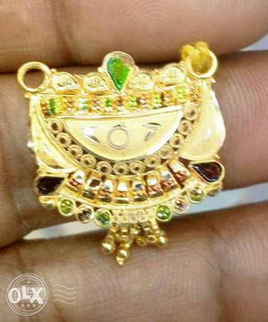 Gold Ring With Green Gemstones