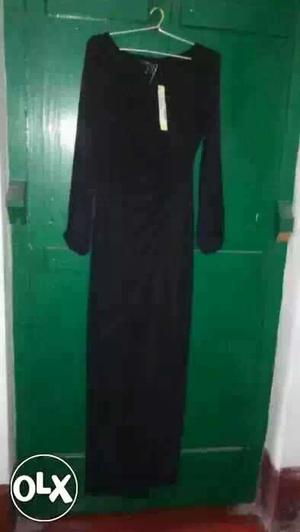 Long black sleek dress. size small. price tag of