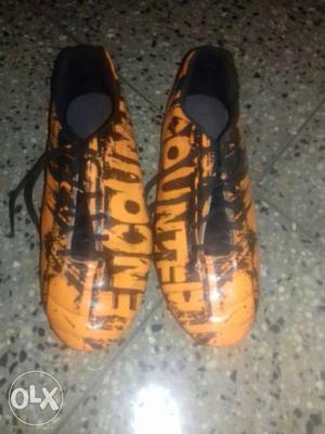 Pair Of Black-and-orange Cleats Size 6