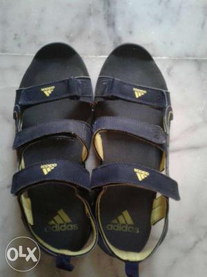 Pair Of Black-and-yellow Adidas Sandals