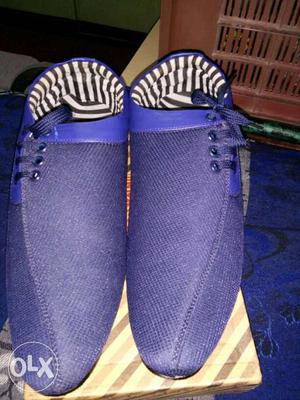 Pair Of Blue Slip On Shoes