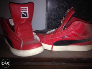 Pair Of Red-and-white Puma High Tops Sneakers