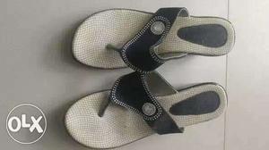 Pair Of White And Black Sandals