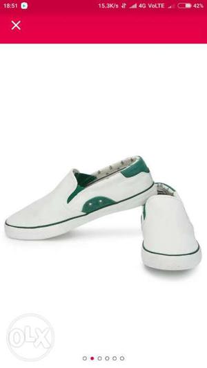 Pair Of White And Green Slip-on Shoes