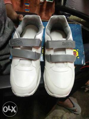 Pair Of White Velcro Strap Shoes