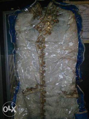 Pair of golden sherwani only 4 hour used.real