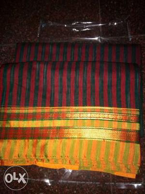 Red Green And Gold Textile