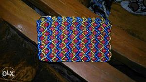 Red, Yellow And Blue Beaded Pad
