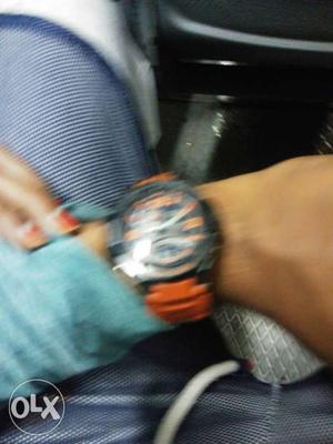 Round Black And Orange Chronograph Watch