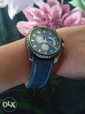 Round Black Face Chronograph Watch With Blue Leather Strap