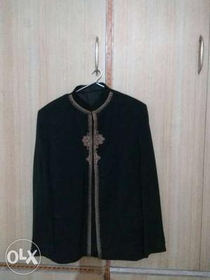Round neck black coat for sale. Fashionable and