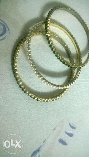 Set of 3 bangles with stones..2green and 1white.