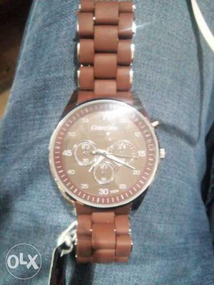Silver And Brown Chronograph Watch