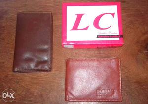 Two Brown Leather Bifold Wallets