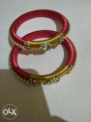 Two Gold-and-red Silk Thread Bracelets