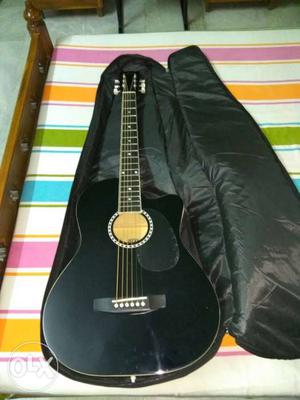 Black Cutaway Acoustic Guitar In Bag