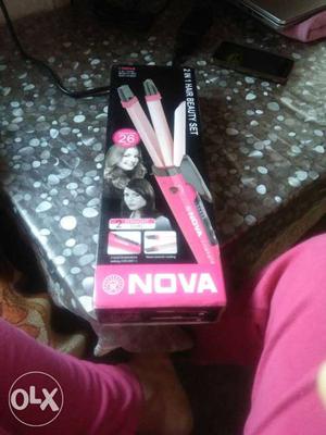 2in one straightner or curler. In pink colour