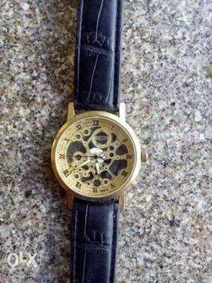 Round Gold Mechanical Chronograph Watch With Black Leather