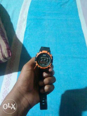Round Orange And Black Chronograph Watch With Black Strap