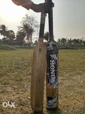 Two Brown Cricket Bats