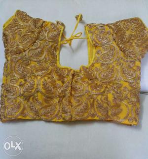 Yellow colour silk blouse with beautiful golden